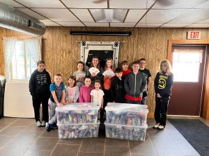 Glencoe Hustlers 4-H Club Assembles care Packages for The Charlie Company for the Holidays!