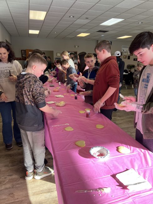 hilltop climbers members decorating cookies