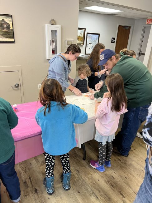 hilltop climbers members decorating cookies