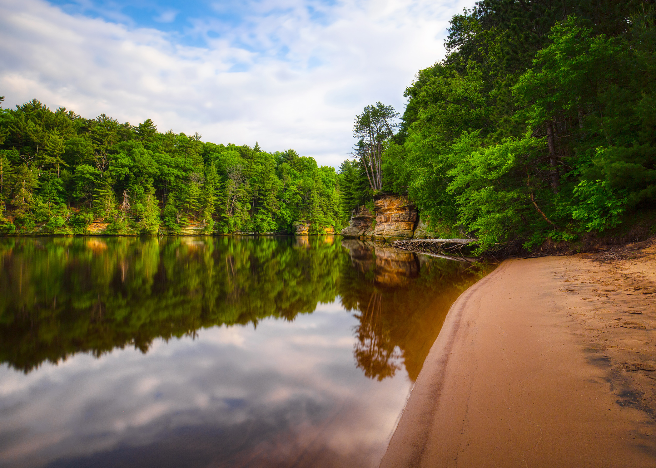 picture of small lake with a sand beach